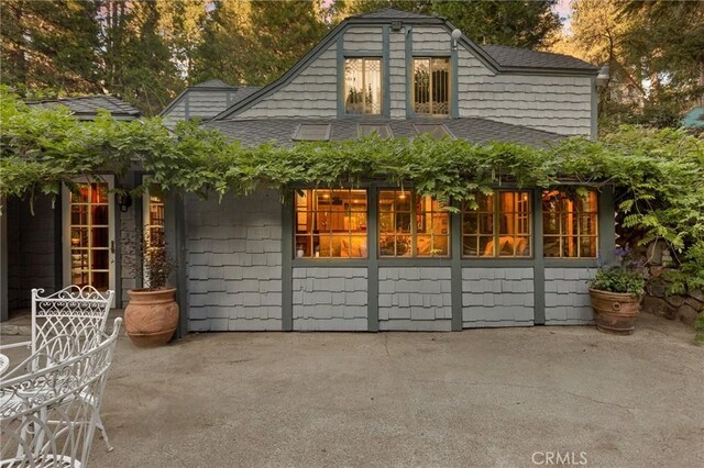 969 Oak Dr, Crestline, CA 92325 - back of house featuring roof with shingles and a patio