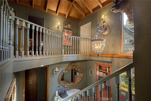 969 Oak Dr, Crestline, CA 92325 - stairs with a wood ceiling with exposed beams, a chandelier, and high vaulted ceiling