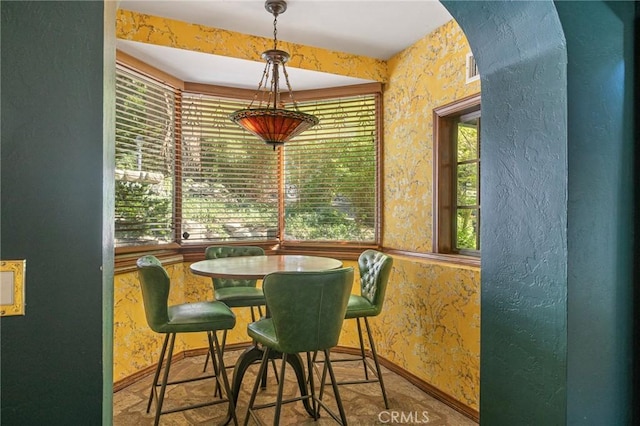 969 Oak Dr, Crestline, CA 92325 - dining space featuring baseboards and arched walkways