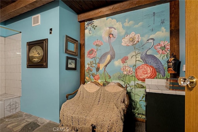 969 Oak Dr, Crestline, CA 92325 - bathroom with stone finish floors, a shower, and beam ceiling