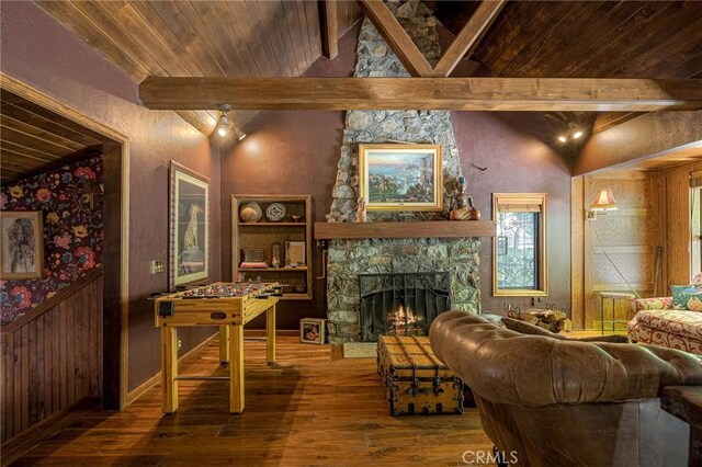 969 Oak Dr, Crestline, CA 92325 - living room with hardwood / wood-style floors, a stone fireplace, wood ceiling, wooden walls, and a wainscoted wall