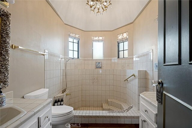 969 Oak Dr, Crestline, CA 92325 - bathroom featuring vanity, a tile shower, and a chandelier