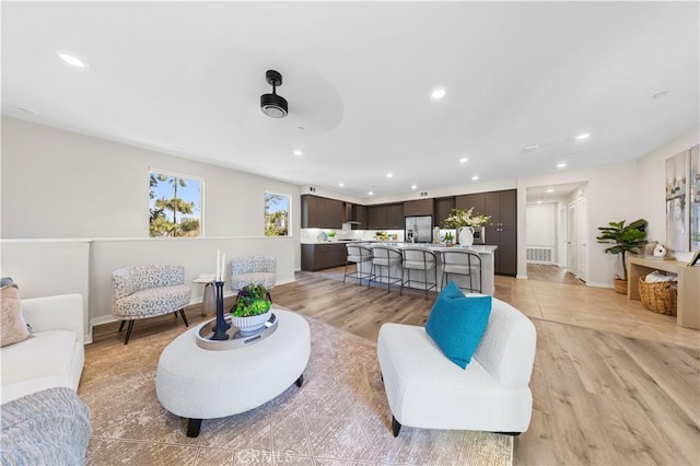 107 Bowery, Irvine, CA 92612 - living room with recessed lighting, light wood-style floors, and ceiling fan