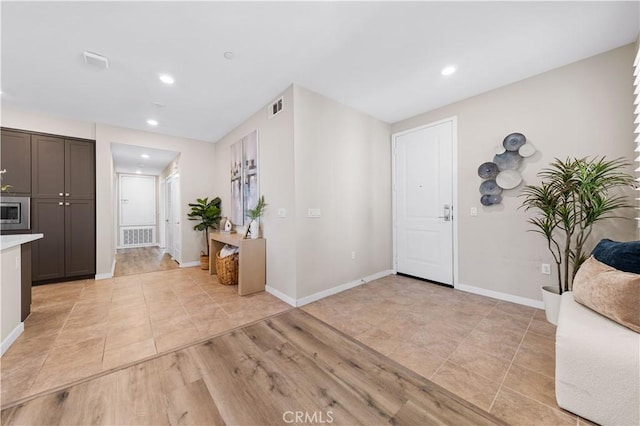 107 Bowery, Irvine, CA 92612 - entryway featuring recessed lighting and light tile patterned flooring