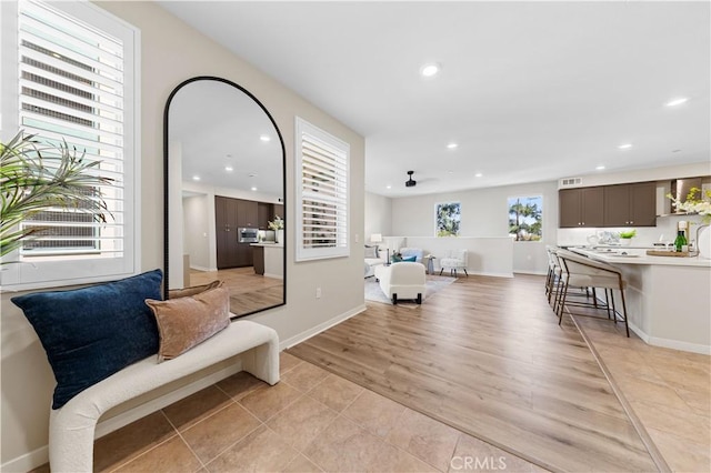107 Bowery, Irvine, CA 92612 - living room with recessed lighting, light wood-style flooring, and ceiling fan