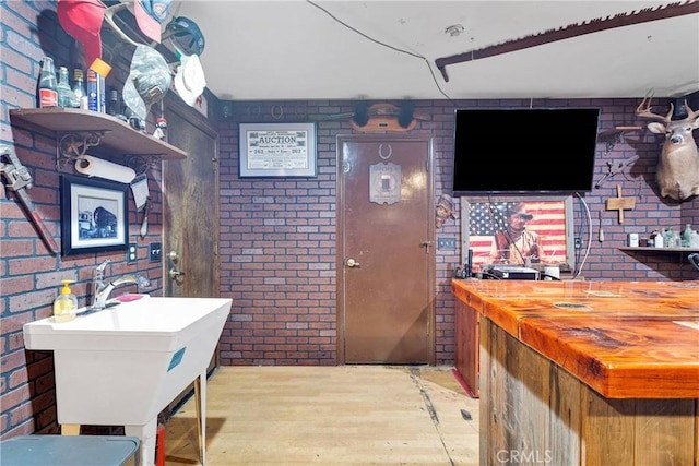7505 Jenkins Ave, Hesperia, CA 92345 - bar area featuring brick wall and wood finished floors