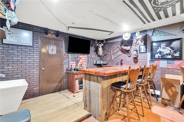 7505 Jenkins Ave, Hesperia, CA 92345 - indoor bar with brick wall and light wood-type flooring