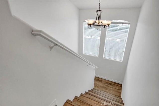 1629 E Palm Ave Unit 3, El Segundo, CA 90245 - stairs featuring wood finished floors and a chandelier