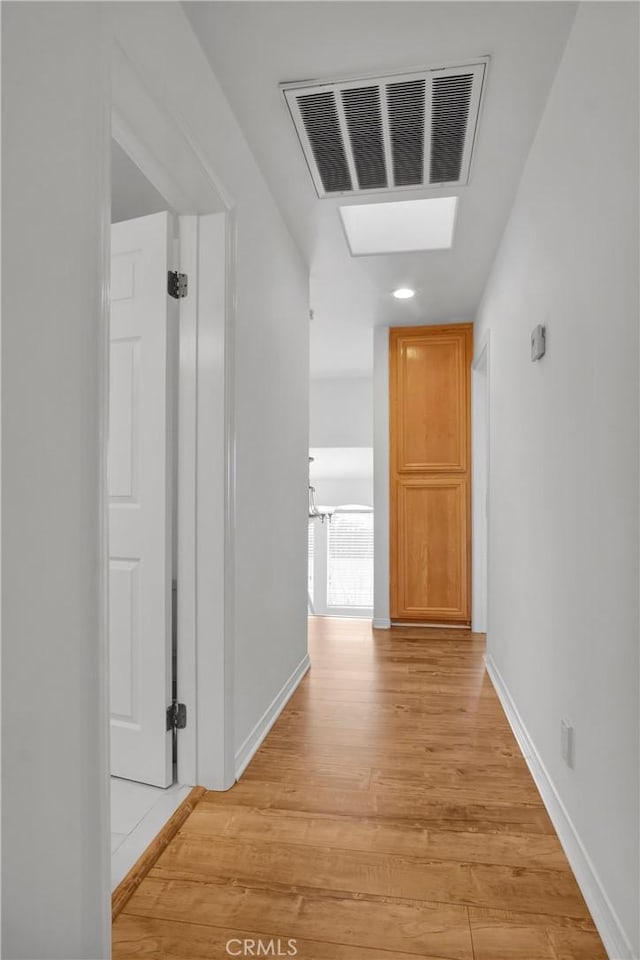 1629 E Palm Ave Unit 3, El Segundo, CA 90245 - hallway with light wood-style floors, a skylight, and recessed lighting