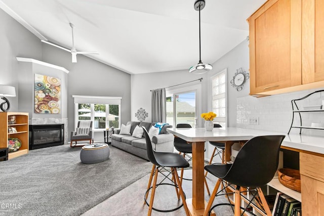 331 N Avon St, Burbank, CA 91505 - dining area with a glass covered fireplace, lofted ceiling, and ceiling fan