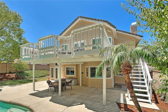 3039 Olympic View Dr, Chino Hills, CA 91709 - back of house with a chimney, stairs, stucco siding, and a patio area