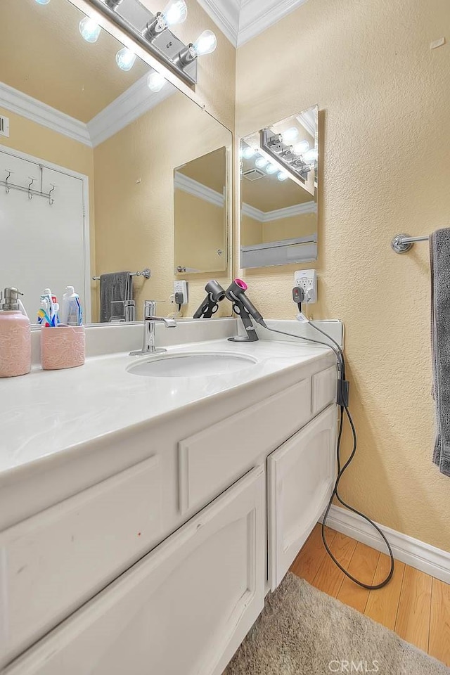 3039 Olympic View Dr, Chino Hills, CA 91709 - bathroom featuring crown molding, vanity, wood finished floors, and a textured wall