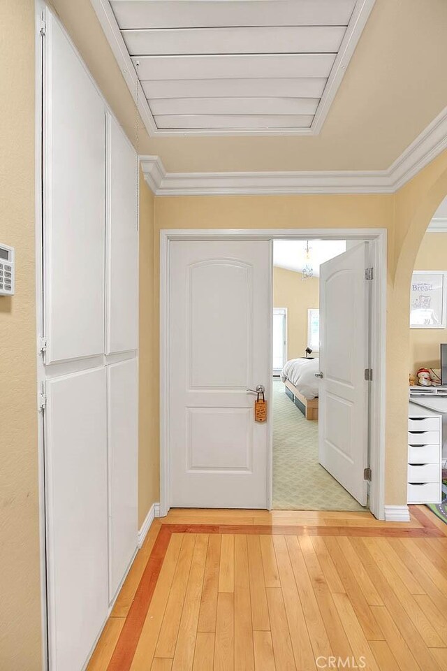 3039 Olympic View Dr, Chino Hills, CA 91709 - hall featuring arched walkways, light wood finished floors, and crown molding