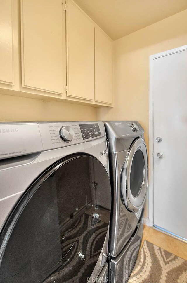 3039 Olympic View Dr, Chino Hills, CA 91709 - laundry room featuring washing machine and clothes dryer, cabinet space, and light tile patterned floors