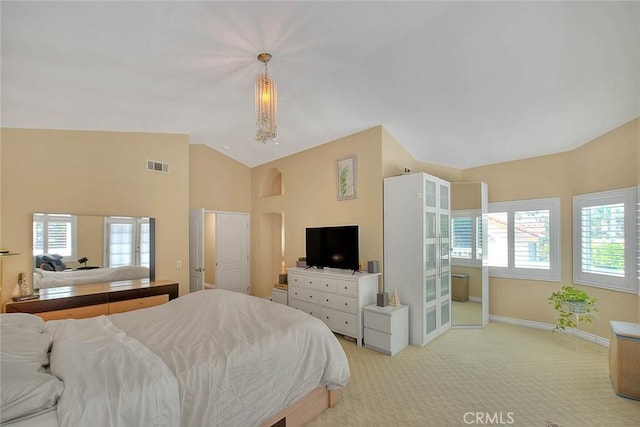 3039 Olympic View Dr, Chino Hills, CA 91709 - bedroom featuring multiple windows, vaulted ceiling, light colored carpet, and arched walkways