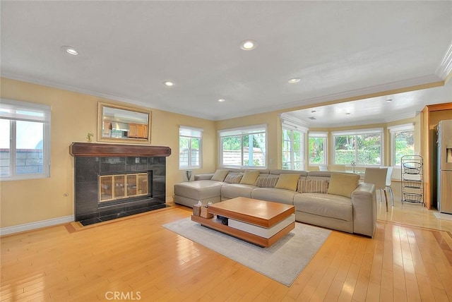 3039 Olympic View Dr, Chino Hills, CA 91709 - living room featuring ornamental molding, light wood-style floors, a tile fireplace, and recessed lighting
