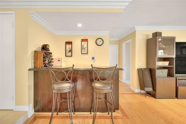 3039 Olympic View Dr, Chino Hills, CA 91709 - indoor dry bar featuring light wood-style floors, recessed lighting, and crown molding