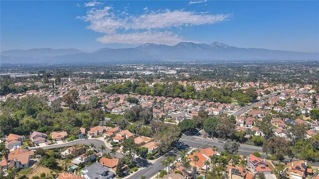 3039 Olympic View Dr, Chino Hills, CA 91709 - aerial view of property's location featuring a mountain backdrop and nearby suburban area