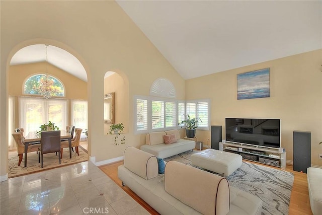 3039 Olympic View Dr, Chino Hills, CA 91709 - living room with arched walkways, plenty of natural light, high vaulted ceiling, and a chandelier