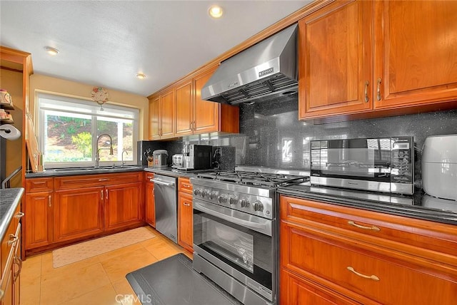 3039 Olympic View Dr, Chino Hills, CA 91709 - kitchen featuring appliances with stainless steel finishes, exhaust hood, backsplash, and brown cabinetry