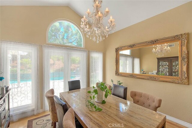 3039 Olympic View Dr, Chino Hills, CA 91709 - dining area with a chandelier, light wood-type flooring, and lofted ceiling
