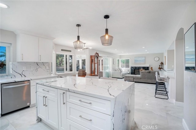 2741 Olympic View Dr, Chino Hills, CA 91709 - kitchen featuring dishwasher, plenty of natural light, decorative backsplash, and a kitchen island