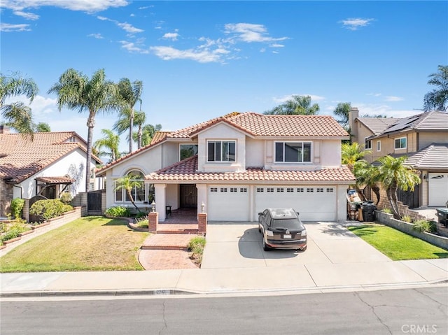 2741 Olympic View Dr, Chino Hills, CA 91709 - mediterranean / spanish-style home featuring stucco siding, a tiled roof, a garage, concrete driveway, and a front yard