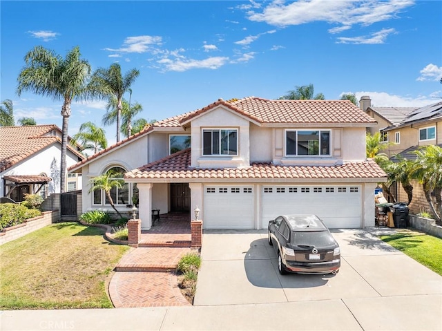 2741 Olympic View Dr, Chino Hills, CA 91709 - mediterranean / spanish-style home featuring concrete driveway, a garage, stucco siding, and a tile roof
