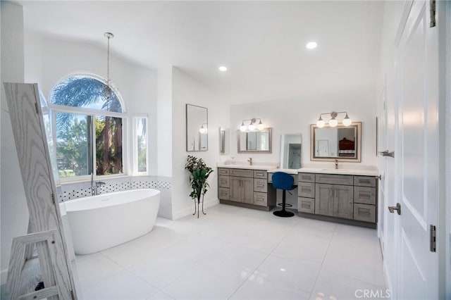 2741 Olympic View Dr, Chino Hills, CA 91709 - full bath with vanity, a freestanding tub, lofted ceiling, tile patterned floors, and recessed lighting