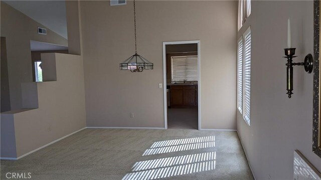 27297 Terrytown Rd, Menifee, CA 92586 - unfurnished dining area with a high ceiling, plenty of natural light, and carpet