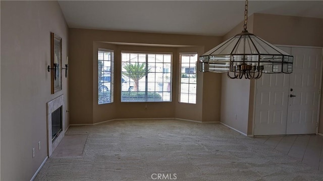 27297 Terrytown Rd, Menifee, CA 92586 - unfurnished dining area featuring carpet flooring, healthy amount of natural light, a chandelier, and a fireplace with flush hearth