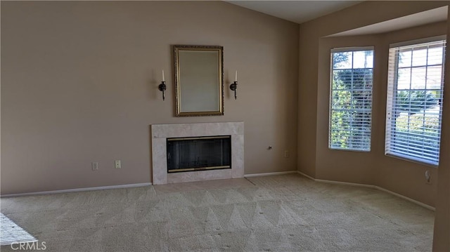 27297 Terrytown Rd, Menifee, CA 92586 - unfurnished living room featuring carpet flooring, a high end fireplace, and lofted ceiling