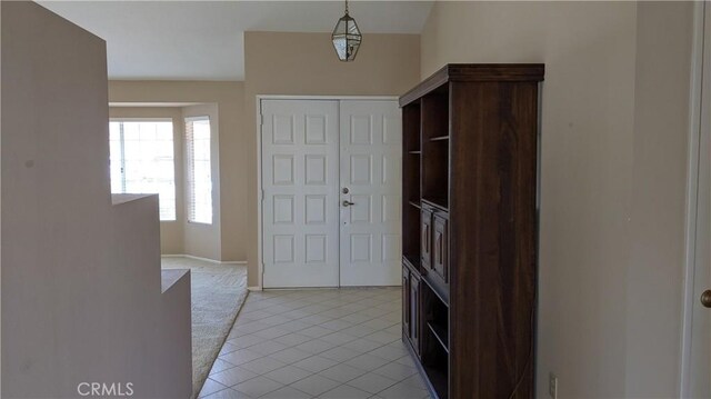 27297 Terrytown Rd, Menifee, CA 92586 - entryway with light tile patterned floors and baseboards