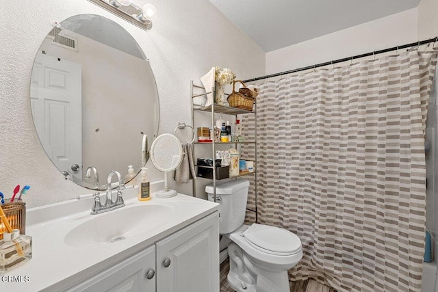 2540 El Dorado Ave Unit A, Oxnard, CA 93033 - bathroom with vanity, a textured wall, and curtained shower