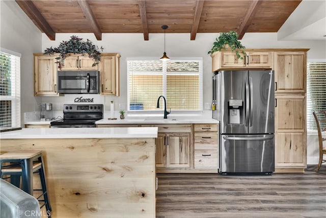 2583 Oak Shores Dr, Bradley, CA 93426 - kitchen with stainless steel appliances, light brown cabinetry, dark wood-style floors, light countertops, and a wooden ceiling with exposed beams