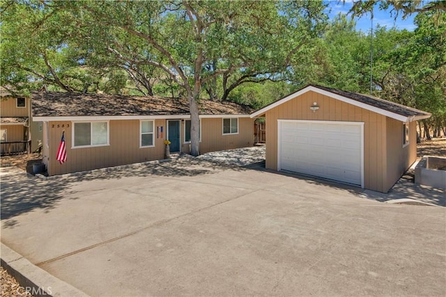 2583 Oak Shores Dr, Bradley, CA 93426 - view of front facade featuring an outdoor structure, a garage, and driveway