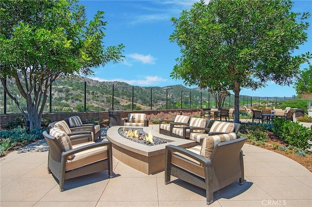 138 Listo St, Rancho Mission Viejo, CA 92694 - view of patio with a mountain view, an outdoor living space with a fire pit, and outdoor dining area