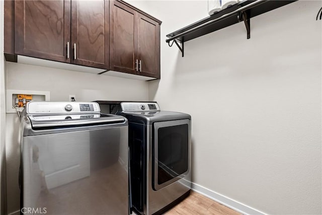 138 Listo St, Rancho Mission Viejo, CA 92694 - laundry area featuring washing machine and dryer, cabinet space, and light wood finished floors
