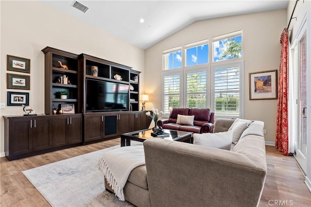 138 Listo St, Rancho Mission Viejo, CA 92694 - living room with light wood-style floors and lofted ceiling