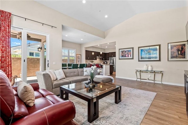 138 Listo St, Rancho Mission Viejo, CA 92694 - living room featuring light wood-style floors, lofted ceiling, and recessed lighting