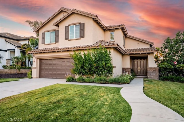 20642 Iris Canyon Rd, Riverside, CA 92508 - mediterranean / spanish home with an attached garage, driveway, a lawn, and stucco siding