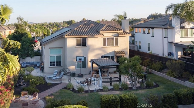 20642 Iris Canyon Rd, Riverside, CA 92508 - rear view of property featuring stucco siding, a patio, a chimney, a tile roof, and an outdoor living space