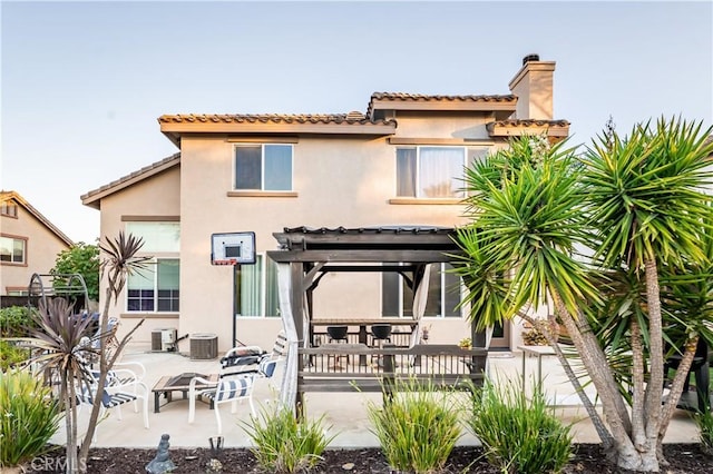 20642 Iris Canyon Rd, Riverside, CA 92508 - rear view of property featuring a pergola, a chimney, stucco siding, and a patio