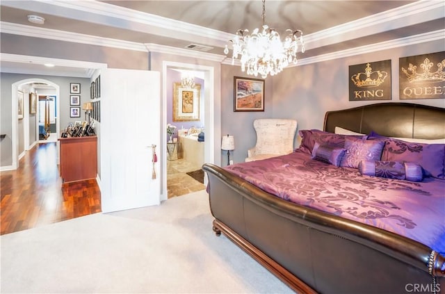 20642 Iris Canyon Rd, Riverside, CA 92508 - bedroom featuring crown molding, arched walkways, a chandelier, wood finished floors, and ensuite bath