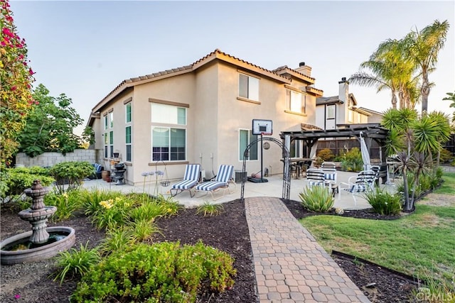 20642 Iris Canyon Rd, Riverside, CA 92508 - back of house with a patio area, stucco siding, a chimney, and a pergola