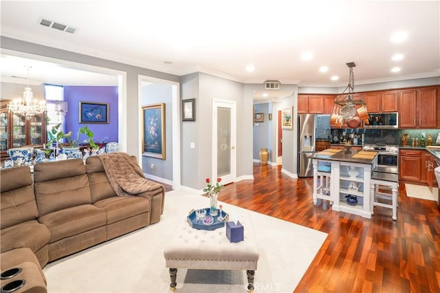 20642 Iris Canyon Rd, Riverside, CA 92508 - living area featuring a chandelier, ornamental molding, dark wood-type flooring, and recessed lighting