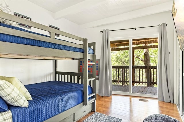 1296 Calgary Dr, Lake Arrowhead, CA 92352 - bedroom with beamed ceiling, wood finished floors, and access to outside