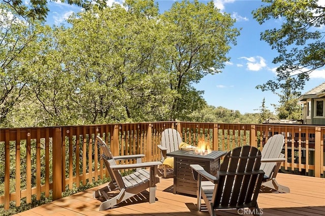 1296 Calgary Dr, Lake Arrowhead, CA 92352 - wooden deck with a fire pit