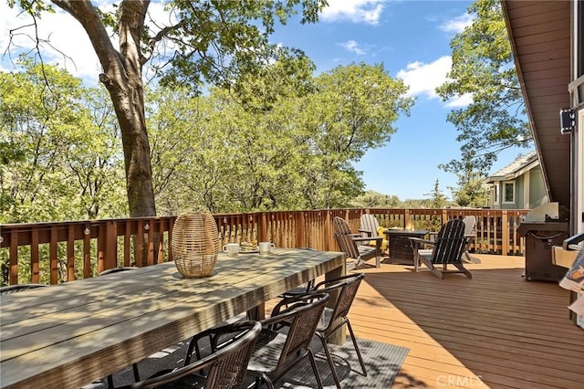 1296 Calgary Dr, Lake Arrowhead, CA 92352 - wooden deck featuring outdoor dining space, an outdoor fire pit, and area for grilling