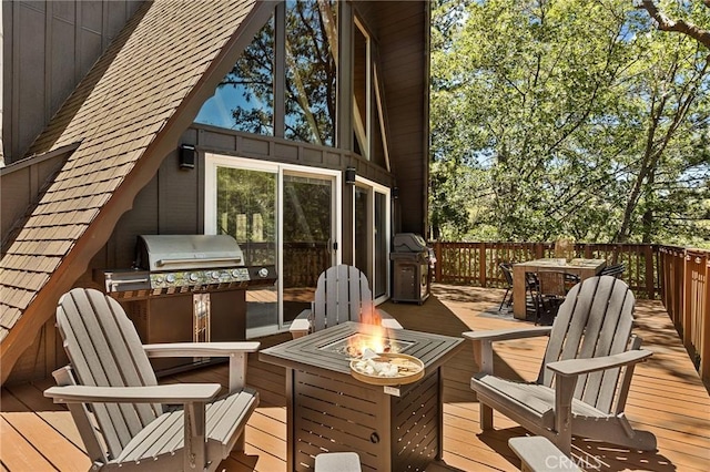 1296 Calgary Dr, Lake Arrowhead, CA 92352 - wooden terrace featuring outdoor dining area, an outdoor fire pit, and grilling area